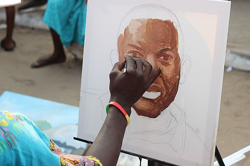 An artist painting a face